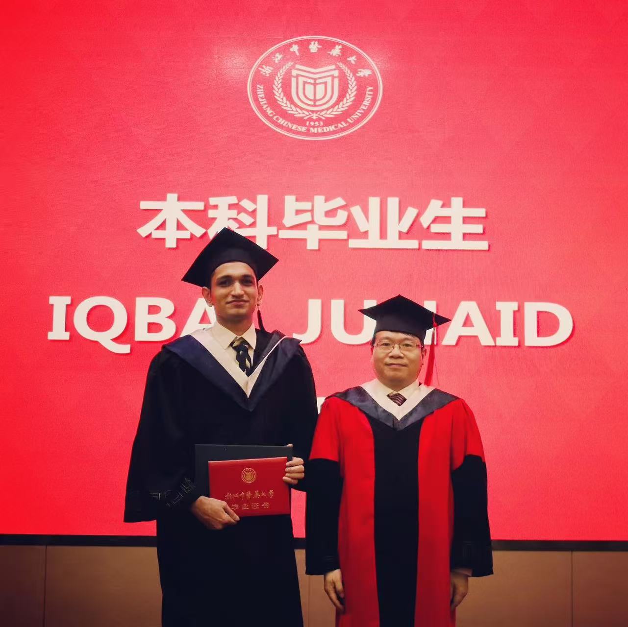 Dr. Junaid Iqbal receiving degree from the President of ZCMU